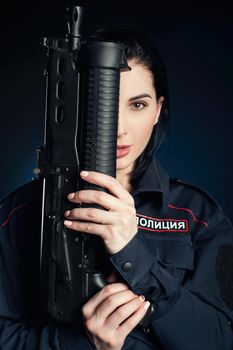 the Portrait of a woman in a Russian police uniform with a rifle English translation police