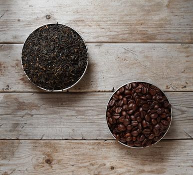 Coffee and tea on a wooden background, top view