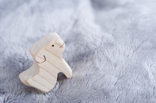 cute wooden toy animals on fluffy fabric