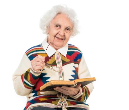 elderly woman flipping an old book isoalted on white background