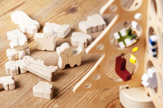 cute wooden toy animal on wood board, tiny toys and shallow depth of field