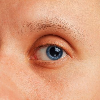 Macro image of irritated male eye