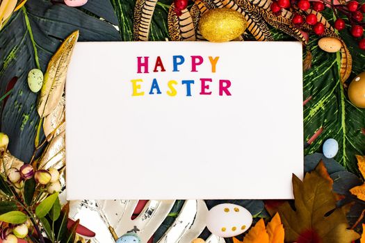 Happy Easter. Congratulatory easter background. Easter eggs and flowers. Flat lay. Nature concept.