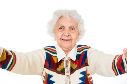 elderly woman taking selfie on a smartphone isolated on white background