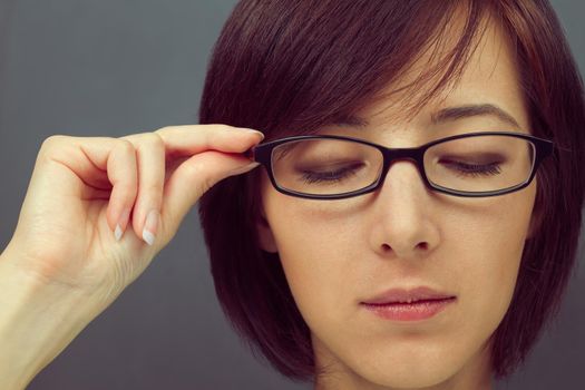 Portrait of a young woman in glasses