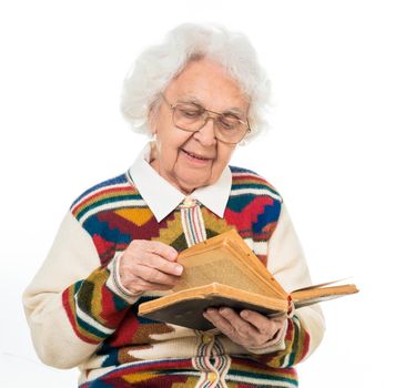 elderly woman flipping an old book isoalted on white background