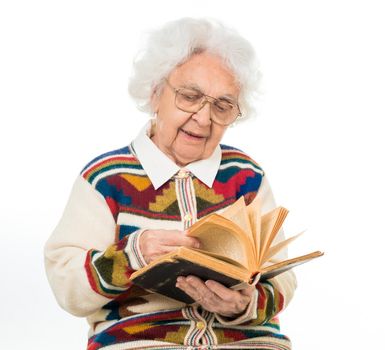 elderly woman flipping an old book isoalted on white background