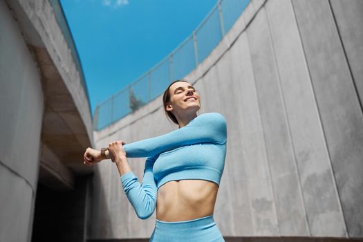 Beautiful fit young woman jogger is running outdoors