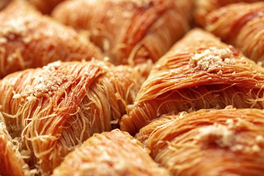 Close up photo of Turkish Baklava dessert with honey and nuts