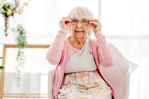 Senior woman wearing eyeglasses and looking at the camera. Pensioner elderly person with glasses for sight