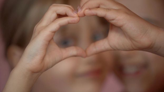Children's hands show signs of heart.