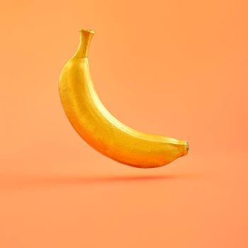 Trendy sunlight Summer  yellow banana  on bright light pink background. Minimal summer concept.