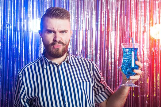 Alcoholism, fun and fool concept - Drunk guy at party in a nightclub