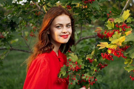 cheerful woman eating berries outdoors fresh air. High quality photo