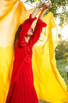 pretty woman nature yellow cloth fresh air glamor. High quality photo