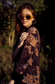woman wearing sunglasses outdoors posing fashion. High quality photo