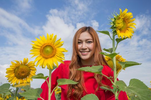 beautiful woman happy and enjoy in sunflower field
