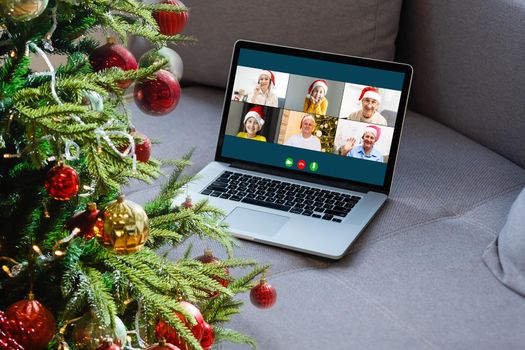 laptop with gift box and christmas lights background