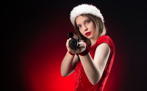 girl in a red bodysuit and a Santa Claus hat with a shotgun in her hands for Christmas