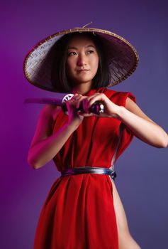 the portrait of an Asian woman in a red cape and an Asian hat with a katana in her hand image of a samurai