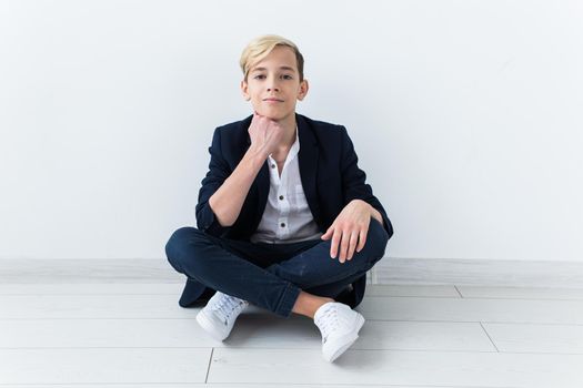 Teenage boy portrait on a white background.