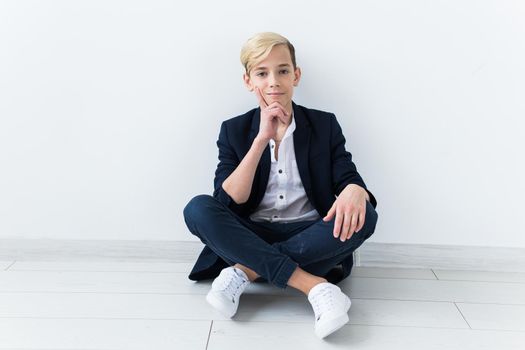 Teenage boy portrait on a white background.