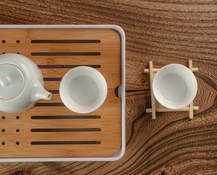 tea table with instruments teapots cups and green tea