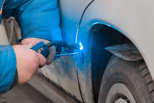 Welding and metal works repair of the car body.