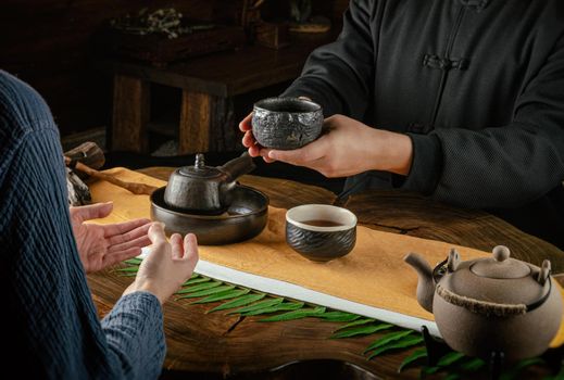 the tea ceremony hand men and women to pour the tea