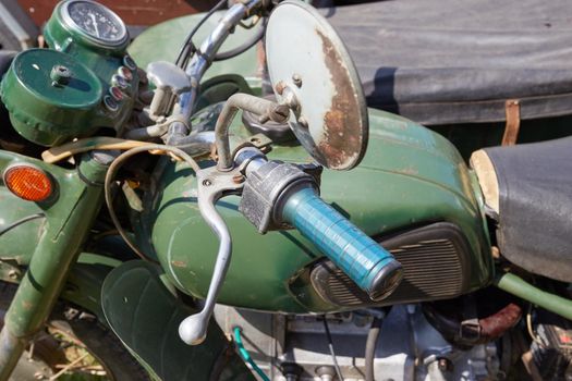 part of an old motorcycle with a sidecar