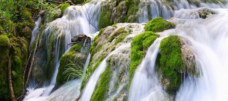 Waterfall in Plitvice Lakes national Park at summer, Croatia. Waterfalls formed by mountain lakes due to melting glaciers