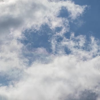 Background of blue sky with white clouds.