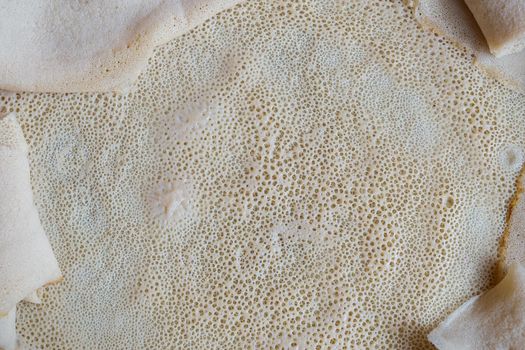 Close up image of Injera, a fermented flatbread made with teff flour