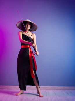 the slender Asian woman an Asian hat with a katana in her hand image of a samurai