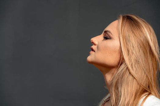 Profile of a beautiful young blonde with closed eyes