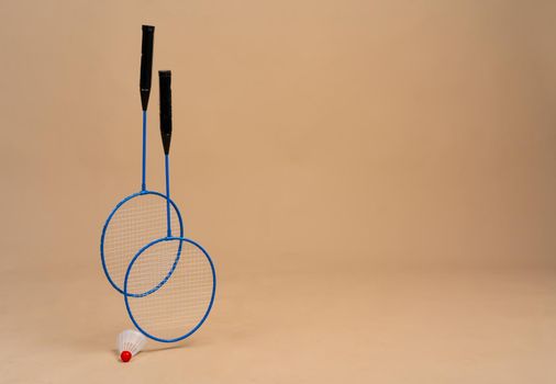 Set of shuttlecock and two badminton rackets. Close up.