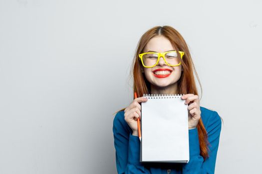 woman secretary with yellow glasses notepad work official. High quality photo