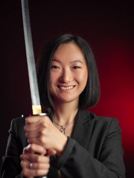 the asian woman in a jacket with a katana in her hands mafia fighter emotions on her face