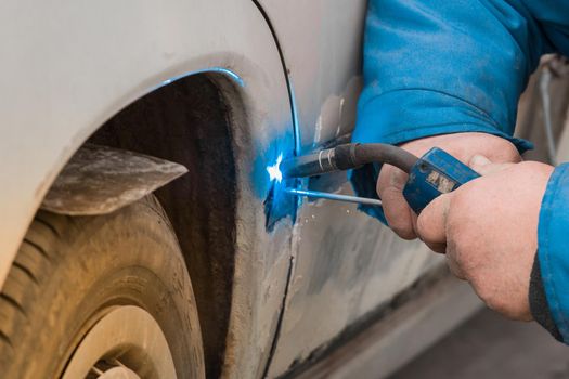 Welding and metal works repair of the car body.