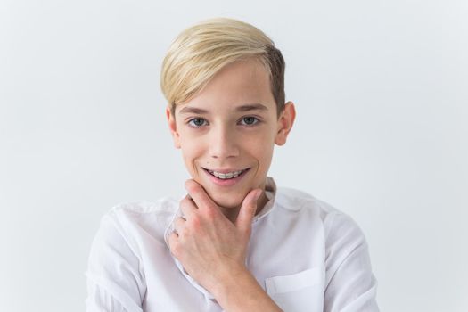 Attractive eleven year old boy with braces on his teeth. Dentistry and teenager