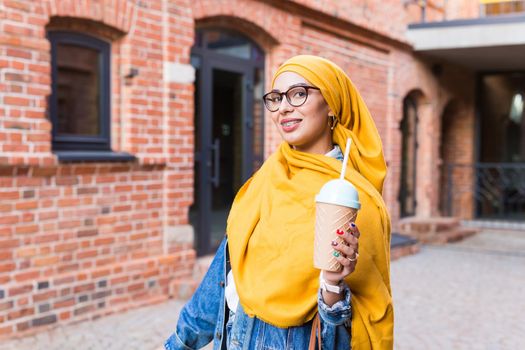 Arabian muslim woman enjoying cocktail outdoor