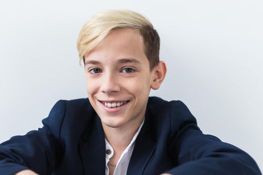 Attractive eleven year old boy with braces on his teeth. Dentistry and teenager
