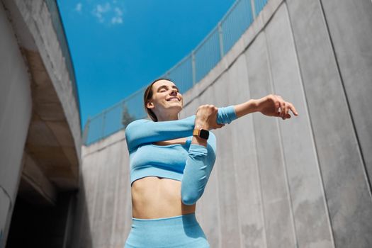 Beautiful fit young woman jogger is running outdoors