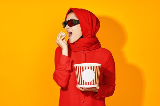 woman in red hijab virtual reality movie fashion fun movie isolated background. High quality photo