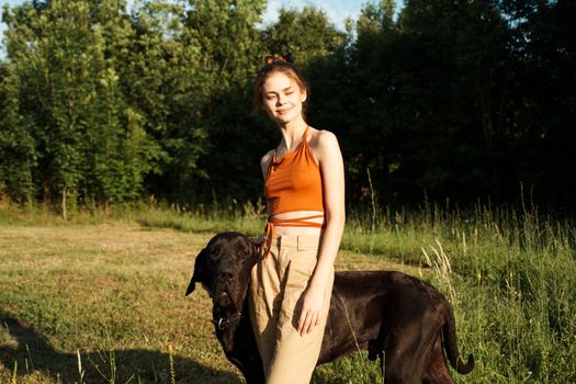 Cheerful Woman and a dog in the nature games Friendship. High quality photo