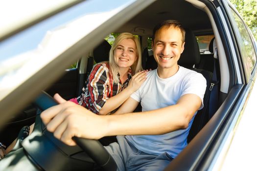 Elderly man driving a car