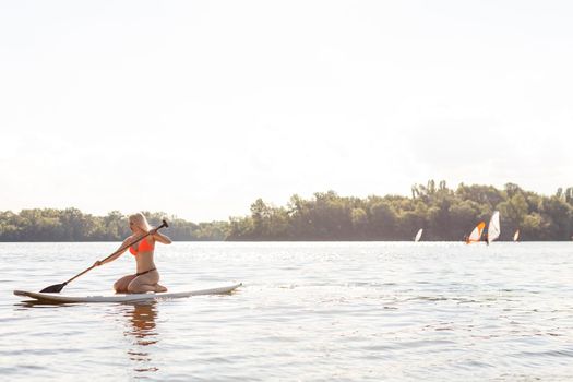 Action Shot of Young Woman on Paddle Board