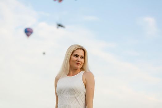 Amazing view with woman and air balloon. Artistic picture. Beauty world. The feeling of complete freedom