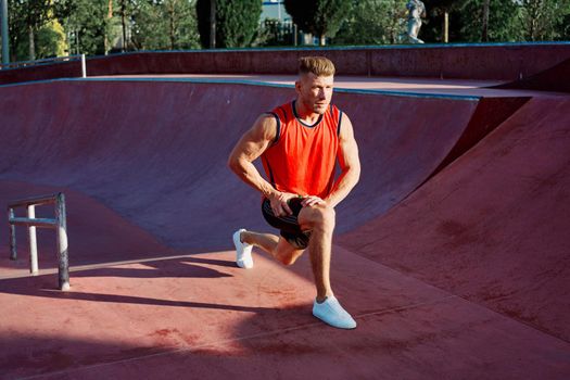 athletic man in red jersey workout exercise pumped up body. High quality photo