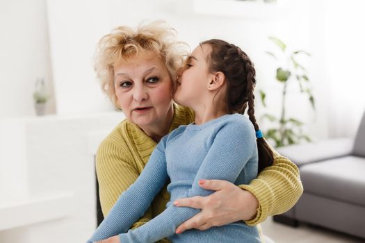 Grandmother and granddaughter portrait, embraced